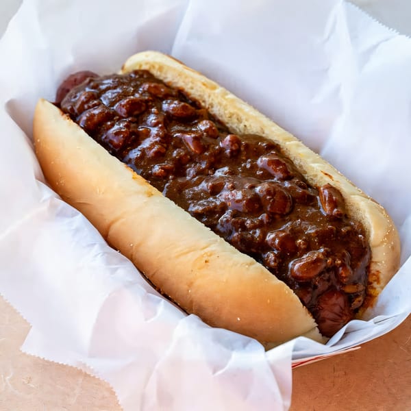 A chili dog from El Capitan's, with a hot dog in a bun generously topped with chili.